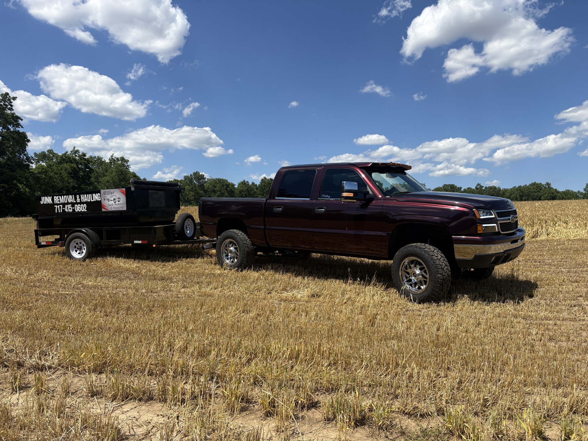 Miller Junk Removal truck and trailer hauling